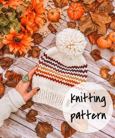 a knitted hat with the words knitting pattern on it next to autumn leaves and pumpkins