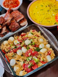 the food is prepared and ready to be eaten on the table with other dishes in the background