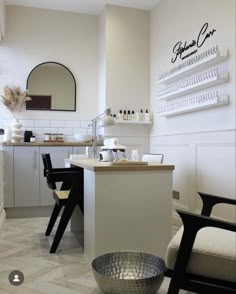 a salon with white walls and black chairs