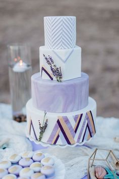 a three tiered cake sitting on top of a table