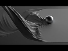 an abstract image of two balls floating in the air, with flowing fabric around them