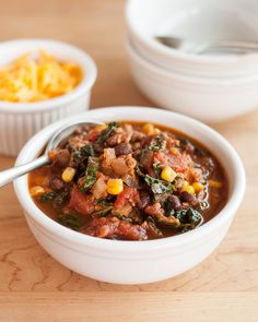 a white bowl filled with chili and beans