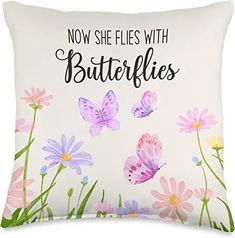 a pillow with butterflies on it that says now she flies with butterflies