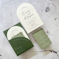 the wedding stationery is green and white