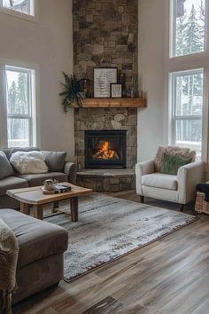 a living room with two couches and a fire place in the middle of it