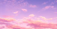 the sky is pink and purple with clouds