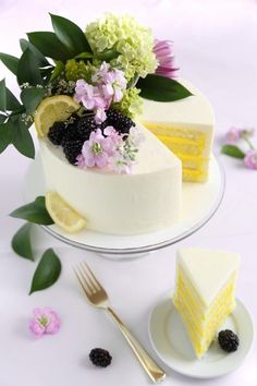 there is a cake with flowers on the top and two slices cut out of it