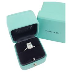 an engagement ring in a blue box