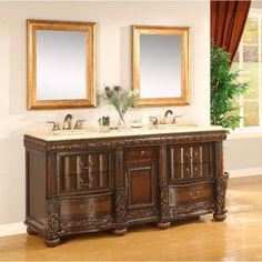 two mirrors are above the double sink vanity