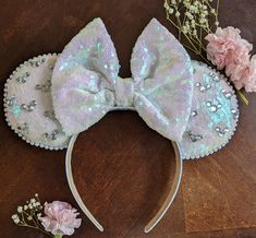 "Hello! Welcome to my shop! All ears are handmade by me. Please follow me on I G @adashoftink for the latest styles and custom designs. Congratulations to the beautiful bride! These ears will make her wedding time so memorable!  Option to have no veil, removable veil or attached veil. This particular set is an iridescent white with so much sparkle when in the sunlight. Rhinestones in mouse formation accent the ears to add even more bling ✨ The ears and bow are handmade and sewn on to a 1 inch headband. This style fits perfectly and comfortable to wear in the parks all day!  ALL SALES ARE FINAL ! *SHIPPING* My ears ship within 3-5 business days with first class shipping. First class will have your item to you within 3-5 days once shipped. If you need your order before that time frame, pleas Types Of Veils, Iridescent Fabric, Iridescent White, Bridal Shower Gift, Turban Headbands, Please Follow Me, Wedding Time, Mouse Ears, Bridal Shower Gifts