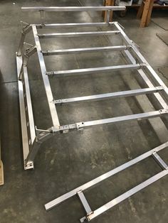 several metal frames sitting on top of a floor