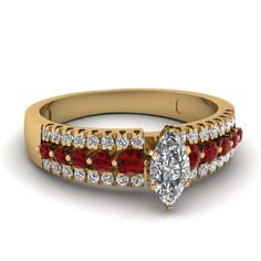 a diamond and ruby engagement ring set in 18k yellow gold with side stones on the band