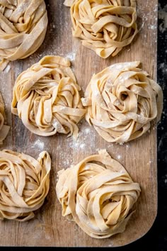 some uncooked pasta on a wooden cutting board