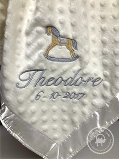 there is a white towel with a horse on it