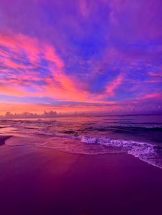 the sun is setting over the ocean with purple clouds