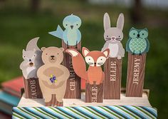 a group of wooden animals standing next to each other