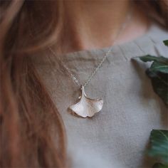 Nature's timeless beauty adorns the neckline through this Silver Ginkgo Leaf Necklace. Exquisite ginkgo leaf pendants cascade down the dainty silver chain, swaying with every movement. It adds an enchanting touch to a romantic date night ensemble. Or lends a cottagecore vibe to a laid-back weekend look. However styled, this necklace charms with its organic elegance - a piece that effortlessly elevates any outfit. DETAILS Materials: 925 Sterling Silver Measurements: Length: 15.75 "(40cm) + Extend Romantic Date Night, Necklace Charms, Nature Necklace, Romantic Date, Ginkgo Leaf, Romantic Dates, Leaf Necklace, Leaf Pendant, Nature Jewelry