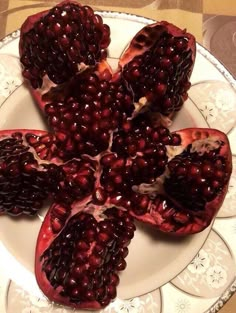 the pomegranates are cut up and ready to be eaten on the plate