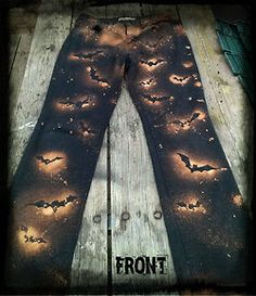 a pair of leggings with bats on them and the words back written in black