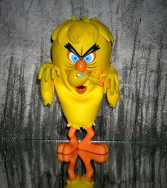 a yellow bird with blue eyes and an orange nose is standing on a reflective surface