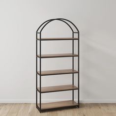 a book shelf with three shelves on each side and a curved metal frame, against a white wall