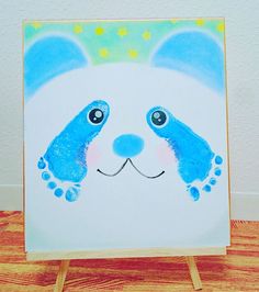 a painting of a blue and white panda bear with stars on it's head