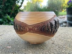 This beautiful wood bowl was individually handcrafted using wood from a pear tree.  The bowl features a natural bark edge around it's mid section.  It has a smooth, polished finish that highlights the wood's unique grain.  It would make a stunning accent piece in any home decor.   DIMENSIONS:  5" across x 3.5" high;  the bowl's opening measures 3.25" across. ORDER PROCESSING TIME: We will have your order carefully packaged and ready for shipping within 1-2 days from purchase. Shipping is complimentary and takes 2-5 days for delivery. (USPS ground advantage) PLEASE NOTE:  All of our home-decor wood items are uniquely one-of-a-kind; meticulously handcrafted in our own wood-turning shop.  We hope that you will love them! OTHER OPTIONS: Visit our shop for other handcrafted wood decor items we Decorative Wood Bowl, Wood Bowl Decor, Natural Wood Decor, Wooden Centerpieces, Rustic Wood Decor, Bark Edge, Wood Items, Pear Tree