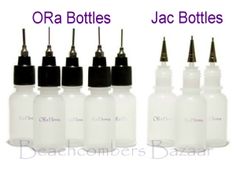 the bottles are filled with different types of ink and their lids have black caps on them