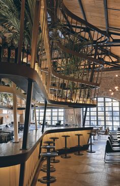 the interior of a restaurant with tables and chairs