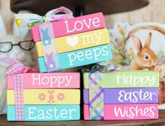 some colorful blocks with words on them sitting on a table next to a basket full of eggs