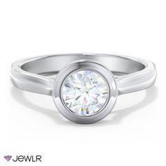 a white gold ring with a round diamond in the center