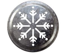 a metal plate with snowflakes on it