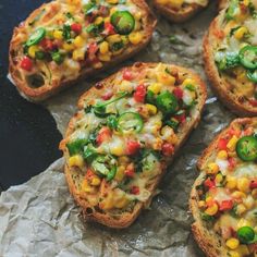 several pieces of bread with various toppings on them