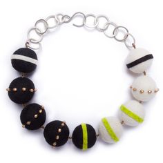 Felt Necklace - This necklace is wonderfully bold yet lightweight. Hand-beaded and hand-appliqued stripes play with color and scale against big felt rounds and an oversized silver chain.18l, 1.25w. Hook clasp closure.