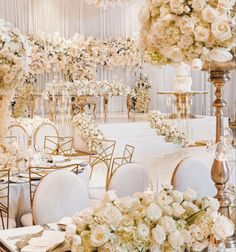 an elegant wedding setup with white flowers and gold chairs