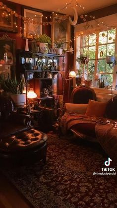 a living room filled with furniture and lots of lights hanging from the ceiling above it