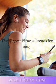 a woman sitting in a chair looking at her cell phone with the text, the biggest fitness trend for 2012