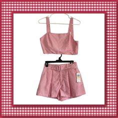 Elevate Your Summer Wardrobe With This Stylish Gb Pink Gingham 2 Piece Set. The Set Includes A Crop Tank Top And Skorts, Perfect For A Day Out With Friends. The Top Is Sleeveless With A Backless Design, While The Skorts Are Belted And Come With Pockets. Made With A Blend Of Polyester And Cotton, This Outfit Is Comfortable To Wear And Suitable For The Summer Season. The Set Is Available In Size Small And Features A Pink Gingham Pattern. It Is A Must-Have Addition To Your Collection And Perfect Fo Striped Sleeveless Summer Sets, Fitted Shorts Matching Set For Spring, Fitted Matching Set Shorts For Spring, Fitted Two-piece Shorts For Spring, Fitted Plaid Sets For Spring, Fitted Gingham Sets For Spring, Summer Cropped Cotton Sets, Casual Gingham Sets For Spring, Casual Spring Gingham Sets