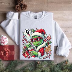 Сute Grinch Coffee Shirt, Сute Little Grinch Iced Coffee t-shirt, Christmas Grinch Shirt, Grinch Coffee Shirt, Christmas Coffee Lovers H O W  T O   O R D E R?  Please, check and review all photos Select Shirt Size and Color from Drop Down menu After choosing the color and size, you can write whatever you want in the personalization field. (If it's a customizable ad) and then add this tshirt to cart. Just do this for other t-shirts. You must collect all tshirts in the same basket and complete the payment. If you are in a hurry, you can purchase a Shipping upgrade on the checkout page. 🚀 Shipping We try to ship same day if we can't latest will be the next day. 🎨 How to Fit Tshirts are Unisex and are "TRUE TO SIZE" according to general customer experience. (as well as in my own experience) Grinch T-shirts, The Grinch Christmas Tshirts, Grinch Im Booked Shirt, Grinch Please Shirt, Thats It Im Not Going Grinch Shirt, Grinch Coffee, Grinch Shirt, Grinch Shirts, Christmas Grinch