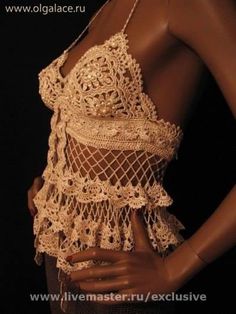 a woman wearing a crochet top with an open back