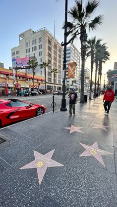 the hollywood walk of fame stars are lined up on the sidewalk in front of buildings