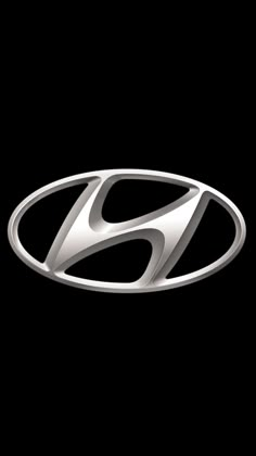 the logo for an automobile company on a black background with a white letter in the center