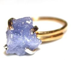 This raw tanzanite nugget ring is rustic and delicate! An gold vermeil shank with sterling silver prong ring is adorned with a lovely raw lavender nugget of natural tanzanite. This ring is adjustable but is best for ring sizes between 5 and 8 1/2. Love! xoxoxo payton For more cool jewelry looks, check out http://www.etsy.com/shop/FizzCandy All FizzCandy creations come beautifully boxed and ready for gift giving. Please see our store policies here - https://www.etsy.com/shop/FizzCandy/policy?ref= Raw Tanzanite Ring, Raw Opal Jewelry, Lavender Jewelry, Gold Twig Ring, Lavender Ring, Lavender Jewellery, Raw Tanzanite, Raw Opal Ring, Watermelon Tourmaline Ring