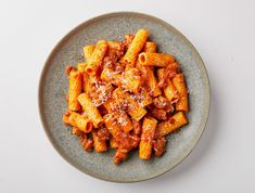 pasta with sauce and parmesan cheese on a plate