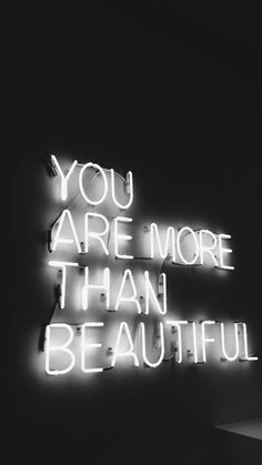 a neon sign that says you are more than beautiful