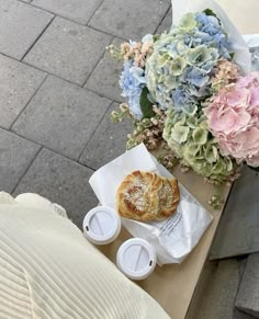 a table with flowers and pastries on it