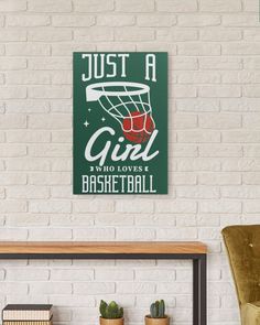 a white brick wall with a sign that says just a girl who loves basketball