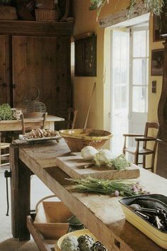 an old kitchen with many different types of food on the counter top and in bowls