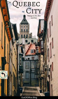 an alley way with buildings on both sides and the words quebec city above it