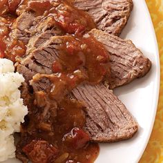 meat, mashed potatoes and gravy on a plate